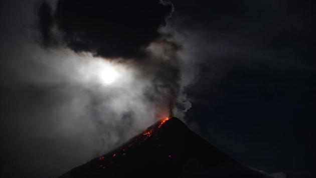 There were gasps of delight for the Philippines at the erupting Mount Mayon volcano. People were treated to a double-spectacle -- a supermoon eclipse rising over a mountain spewing ash and lava. (Ted Aljibe / AFP) There were gasps of delight for the Philippines at the erupting Mount Mayon volcano. People were treated to a double-spectacle -- a supermoon eclipse rising over a mountain spewing ash and lava. (Ted Aljibe / AFP)