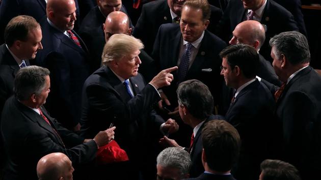 US President Donald Trump talks with members of Congress following the State of the Union address at the chamber of US House of Representatives in Washington DC. (AFP) US President Donald Trump talks with members of Congress following the State of the Union address at the chamber of US House of Representatives in Washington DC. (AFP)