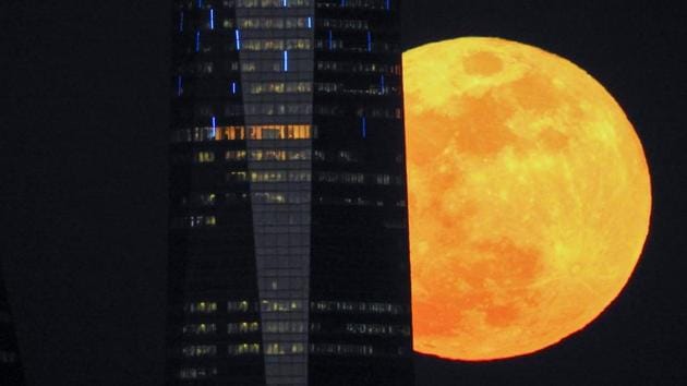 A full moon “supermoon” rises next to a skyscraper in Madrid, Spain. NASA trained its instruments on the Lunar Reconnaissance Orbiter to measure the effect of the temperature drop during the one-hour-16-minute eclipse. Seeing what happens when the surface of the Moon cools quickly will help “understand some of the characteristics of the regolith -- the mixture of soil and loose rocks on the surface -- and how it changes over time.” (Paul Hanna / REUTERS) A full moon “supermoon” rises next to a skyscraper in Madrid, Spain. NASA trained its instruments on the Lunar Reconnaissance Orbiter to measure the effect of the temperature drop during the one-hour-16-minute eclipse. Seeing what happens when the surface of the Moon cools quickly will help “understand some of the characteristics of the regolith -- the mixture of soil and loose rocks on the surface -- and how it changes over time.” (Paul Hanna / REUTERS)
