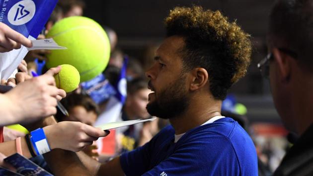 France's Jo-Wilfried Tsonga signs autographs during a training session ahead of the Davis Cup tennis match between France and the Netherlands at the Halle Olympique Stadium in Albertville. (AFP) France's Jo-Wilfried Tsonga signs autographs during a training session ahead of the Davis Cup tennis match between France and the Netherlands at the Halle Olympique Stadium in Albertville. (AFP)