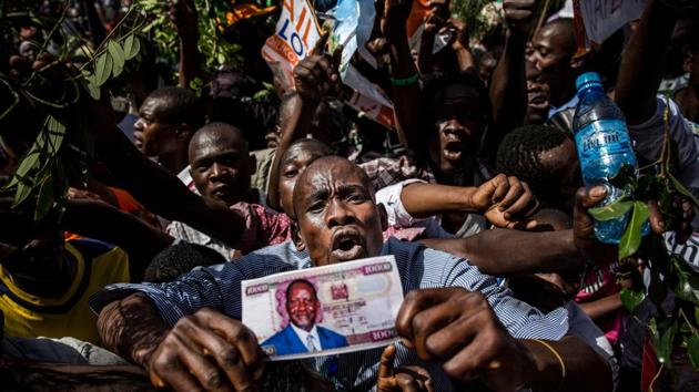 Supporters react before the Kenyan opposition National Super Alliance (NASA) coalition leader has himself sworn in as the 'people's president' on January 30, 2018 in Nairobi. (Luis Tato / AFP) Supporters react before the Kenyan opposition National Super Alliance (NASA) coalition leader has himself sworn in as the 'people's president' on January 30, 2018 in Nairobi. (Luis Tato / AFP)