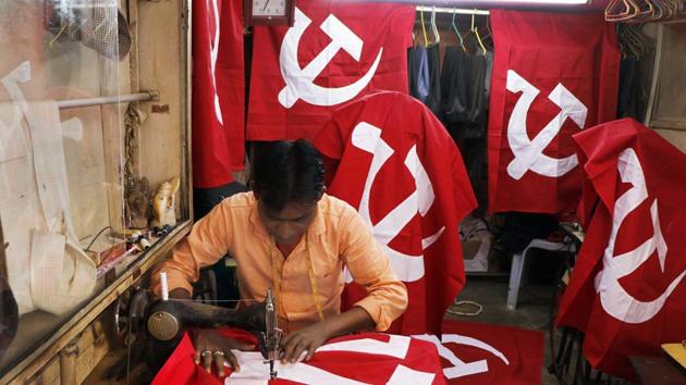 A tailor stitches CPI(M) party flags at a workshop, ahead of Tripura assembly election, in Agartala on Friday.(PTI)