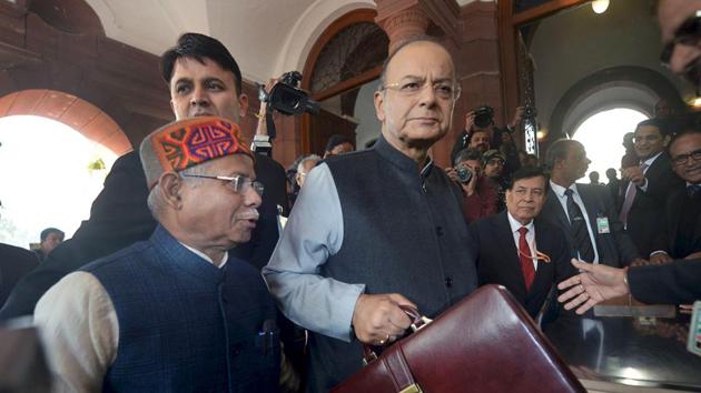 Union Minister for Finance and Corporate Affairs Arun Jaitley with Minister of State for Finance Shiv Pratap Shukla arrives at Parliament House to present the Union Budget 2018-19 in New Delhi on Thursday.(PTI)