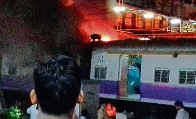 A fire broke out in one of the coaches of a Thane-bound train on Friday. (HT Photo) A fire broke out in one of the coaches of a Thane-bound train on Friday. (HT Photo)