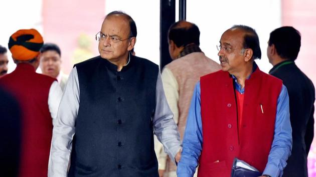Unon finance minister Arun Jaitley and Union minister Vijay Goel arrive to attend the BJP parliamentary party meeting, during the Budget session of Parliament in New Delhi on Thursday.