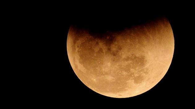 In Chandigarh, the moon put up a striking celestial show as a coppery red orb rose high up in the sky to mark a rare lunar eclipse on January 31, 2018. After decades, moon-gazers saw a super moon, when it looks bigger and brighter than ever, a blue moon, which is the second full moon in a calendar month, and a blood moon, a reference to the red colour of an eclipse. (Ravi Kumar / HT Photo) In Chandigarh, the moon put up a striking celestial show as a coppery red orb rose high up in the sky to mark a rare lunar eclipse on January 31, 2018. After decades, moon-gazers saw a super moon, when it looks bigger and brighter than ever, a blue moon, which is the second full moon in a calendar month, and a blood moon, a reference to the red colour of an eclipse. (Ravi Kumar / HT Photo)
