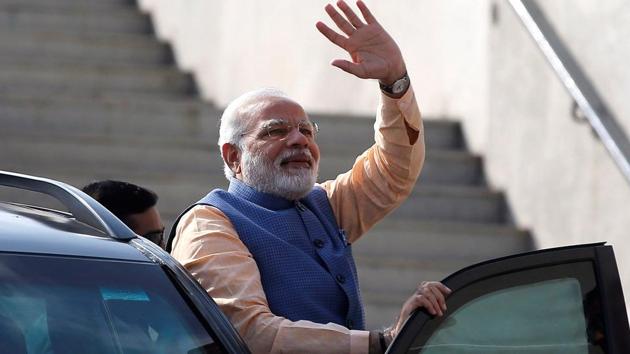 Prime Minister Narendra Modi waves to his supporters before boarding a sea-plane on the Sabarmati river on December 12, 2017.(REUTERS) Prime Minister Narendra Modi waves to his supporters before boarding a sea-plane on the Sabarmati river on December 12, 2017.(REUTERS)
