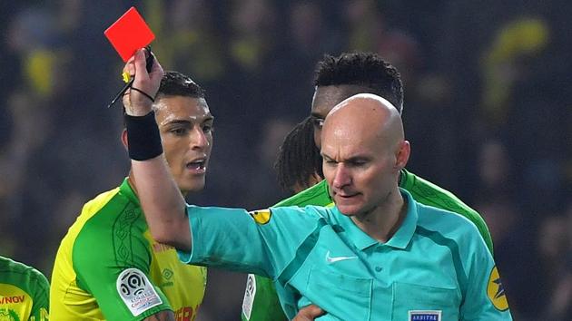 Referee Tony Chapron (R) had kicked out at Nantes' Brazilian defender Diego Carlos (L) during a Ligue 1 game in January. (AFP) Referee Tony Chapron (R) had kicked out at Nantes' Brazilian defender Diego Carlos (L) during a Ligue 1 game in January. (AFP)