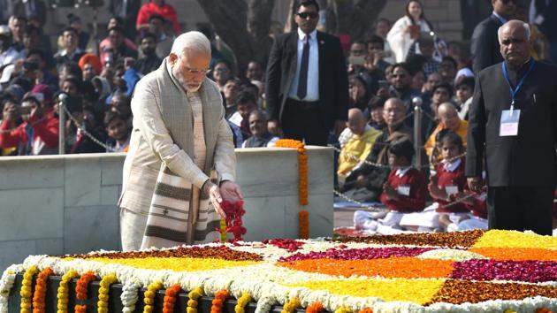PM Narendra Modi pays homage to Mahatma Gandhi on his 70th death anniversary, also observed as Martyrs' Day at Rajghat in New Delhi on January 30, 2018. (Arvind Yadav / HT Photo) PM Narendra Modi pays homage to Mahatma Gandhi on his 70th death anniversary, also observed as Martyrs' Day at Rajghat in New Delhi on January 30, 2018. (Arvind Yadav / HT Photo)