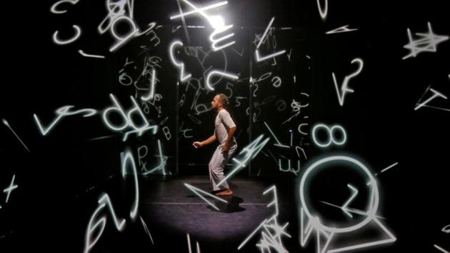 Priyabrat Panigrahi, an artist, performs Hakanai, a choreographic work that features a solo dancer surrounded by a cubist landscape of moving digital images, in an auditorium in Chennai on January 28, 2018. (Abhishek N. Chinnappa / REUTERS) Priyabrat Panigrahi, an artist, performs Hakanai, a choreographic work that features a solo dancer surrounded by a cubist landscape of moving digital images, in an auditorium in Chennai on January 28, 2018. (Abhishek N. Chinnappa / REUTERS)