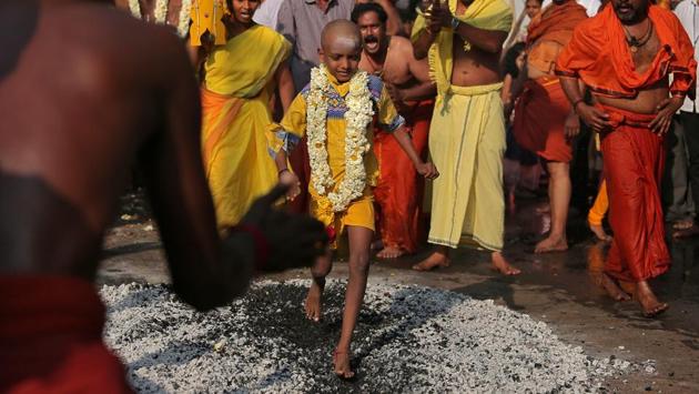 A boy walks over burning coal as part of the Thaipusam festival in Chennai on January 31, 2018. Hindu devotees across Malaysia, Singapore, India, Sri Lanka celebrated the annual Thaipusam festival, with many piercing their skin with hooks and skewers to show devotion to the deity Murugan. (P. Ravikumar / REUTERS) A boy walks over burning coal as part of the Thaipusam festival in Chennai on January 31, 2018. Hindu devotees across Malaysia, Singapore, India, Sri Lanka celebrated the annual Thaipusam festival, with many piercing their skin with hooks and skewers to show devotion to the deity Murugan. (P. Ravikumar / REUTERS)