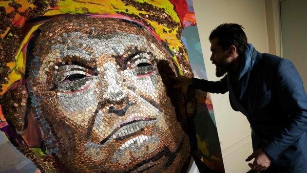 Ukranian artist Daniel Green speaks about the portrait of US President Donald Trump, made of US pennies, nickels and dimes, and created by himself and Ukranian artist Daria Marchenko, at St George Academy. (AFP) Ukranian artist Daniel Green speaks about the portrait of US President Donald Trump, made of US pennies, nickels and dimes, and created by himself and Ukranian artist Daria Marchenko, at St George Academy. (AFP)