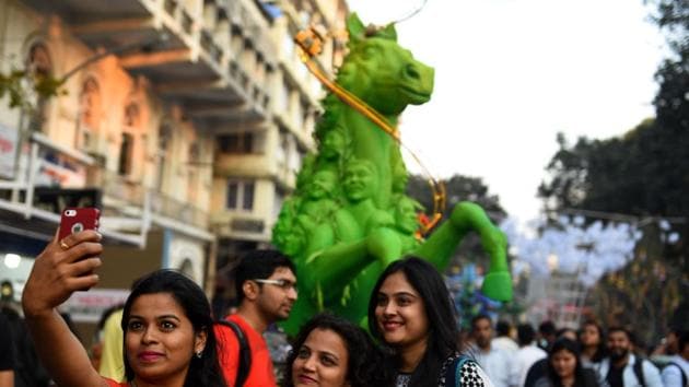 Rampart Row came alive with a sea of colour and chatter as happy crowds strolled among the installations on the opening day of the Hindustan Times Kala Ghoda Arts Festival.(Satish Bate/HT)