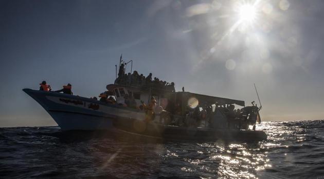 Refugees and migrants wait to be rescued by aid workers after leaving Libya. About 90 people are feared drowned after a boat capsized off Libya’s coast. (AP / Representative Photo) Refugees and migrants wait to be rescued by aid workers after leaving Libya. About 90 people are feared drowned after a boat capsized off Libya’s coast. (AP / Representative Photo)
