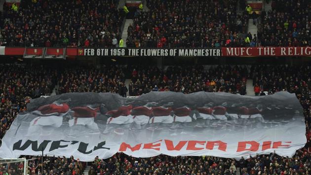 A banner that reads "we'll never die" travels across the Stretford End in commemoration of the 1958 Munich Air Disaster in the 60th anniversary year of the crash that killed 23 during the Premier League match between Manchester United and Huddersfield Town at Old Trafford on Saturday. (AFP) A banner that reads "we'll never die" travels across the Stretford End in commemoration of the 1958 Munich Air Disaster in the 60th anniversary year of the crash that killed 23 during the Premier League match between Manchester United and Huddersfield Town at Old Trafford on Saturday. (AFP)