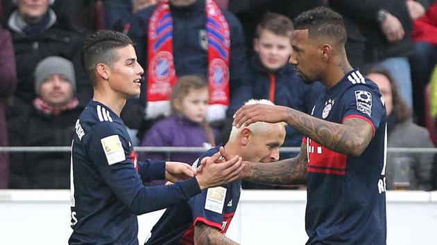 Bayern Munich's James Rodriguez (L) celebrates scoring against Mainz in a Bundesliga game on Saturday.(AFP)