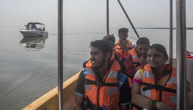 Visitors take the first boat ride of flamingo sanctuary in Thane creek on Thursday, February 1.(Pratik Chorge/HT Photo) Visitors take the first boat ride of flamingo sanctuary in Thane creek on Thursday, February 1.(Pratik Chorge/HT Photo)
