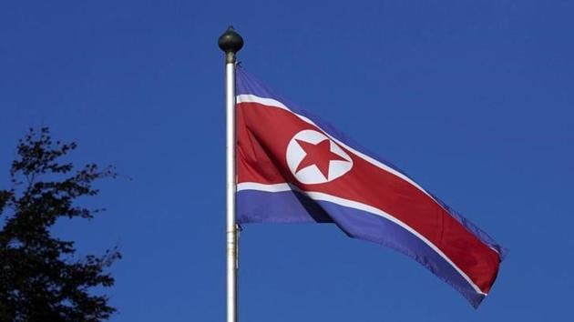 FILE PHOTO: A North Korean flag flies on a mast at the Permanent Mission of North Korea in Geneva October 2, 2014. REUTERS/Denis Balibouse/Files
