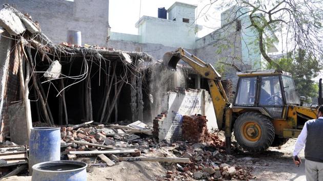The ‘illegal’ under-construction building being demolished in Jalandhar on Friday. (Pardeep Pandit/HT) The ‘illegal’ under-construction building being demolished in Jalandhar on Friday. (Pardeep Pandit/HT)