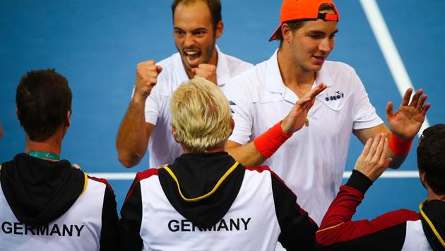 Tim Puetz (top C) and Jan-Lennard Struff (top R) of Germany celebrate with teammates following their doubles match against Matthew Ebden and John Peers of Australia in their Davis Cup World Group tie at Pat Rafter Arena in Brisbane on Saturday. (AFP) Tim Puetz (top C) and Jan-Lennard Struff (top R) of Germany celebrate with teammates following their doubles match against Matthew Ebden and John Peers of Australia in their Davis Cup World Group tie at Pat Rafter Arena in Brisbane on Saturday. (AFP)