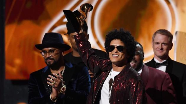 The feel-good Bruno Mars, who has revived retro funk and R&B for a new generation, swept the 60th Grammy Awards in a surprise snub for the hip-hop world. Mars took home Album of the Year for “24K Magic” as well as Record of the Year, which recognizes the top tune, for the album’s title track. (Timothy A. Clary / AFP) The feel-good Bruno Mars, who has revived retro funk and R&B for a new generation, swept the 60th Grammy Awards in a surprise snub for the hip-hop world. Mars took home Album of the Year for “24K Magic” as well as Record of the Year, which recognizes the top tune, for the album’s title track. (Timothy A. Clary / AFP)