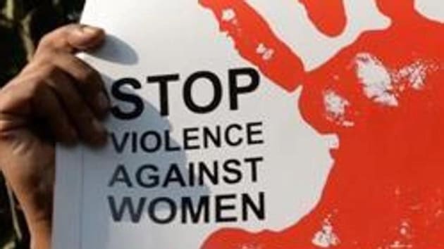 An activist hold a placard during a rally to protest rising instances of violence against women in New Delhi.(AFP photo/representative image))