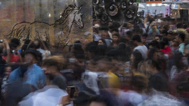 Visitors enjoy the installations at Kala Ghoda on Friday. (Satish Bate/HT) Visitors enjoy the installations at Kala Ghoda on Friday. (Satish Bate/HT)