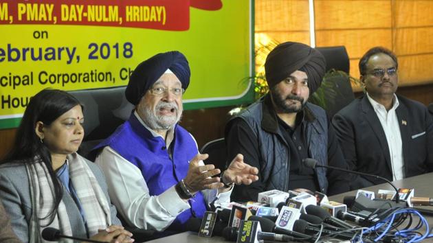 (From Left) Haryana urban local bodies minister Kavita Jain, minister of state for housing and urban affairs Hardeep Singh Puri, and Punjab local bodies minister Navjot Singh Sidhu Minister at UT guest house in Chandigarh on Saturday. (Karun Sharma/HT) (From Left) Haryana urban local bodies minister Kavita Jain, minister of state for housing and urban affairs Hardeep Singh Puri, and Punjab local bodies minister Navjot Singh Sidhu Minister at UT guest house in Chandigarh on Saturday. (Karun Sharma/HT)