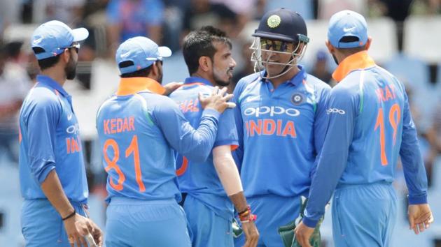 Yuzvendra Chahal celebrates with teammates the dismissal JP Duminy during the second ODI match between South Africa and India in Centurion.(AFP)