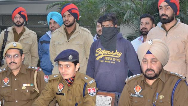 ADCP Gurpreet Kaur Purewal with other police officers addressing mediapersons regarding the arrest of the rape accused (face covered), in Ludhiana on Sunday. (Gurminder Singh/HT) ADCP Gurpreet Kaur Purewal with other police officers addressing mediapersons regarding the arrest of the rape accused (face covered), in Ludhiana on Sunday. (Gurminder Singh/HT)