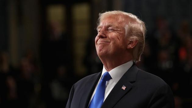 (FILES) In this file photo taken on January 30, 2018 US President Donald Trump smiles during the State of the Union address in the chamber of the US House of Representatives on in Washington, DC.(AFP)