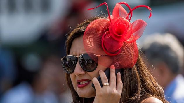 The Indian annual thoroughbred horse race is not just about horses. Fashion has always been an important part of the Indian Derby, and elaborate headgear is the norm. (Pratik Chorge / HT Photo)