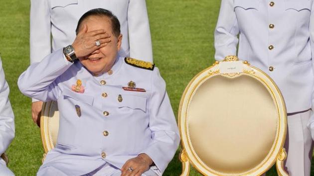 Thailand’s deputy PM Prawit Wongsuwan, displaying a watch he is wearing, during a photo call with other members of a new cabinet in Bangkok on Dec 4, 2017.(AFP File Photo)