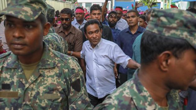 Maldivian president Abdulla Yameen, center, surrounded by his body guards arrives to address his supporters in Male, Maldives on Saturday.(AP Photo)