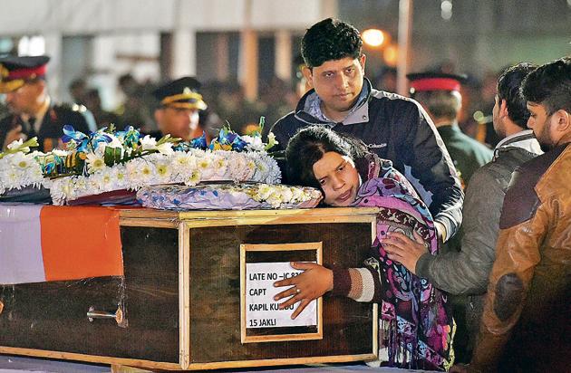 Captain Kapil Kundu's sister mourns while paying tribute to her brother after his mortal remains were brought at AFS Palam in New Delhi on Monday. Captain Kundu was among the four jawans killed in shelling by Pakistan in Kashmir’s Rajouri district. (PTI Photo) Captain Kapil Kundu's sister mourns while paying tribute to her brother after his mortal remains were brought at AFS Palam in New Delhi on Monday. Captain Kundu was among the four jawans killed in shelling by Pakistan in Kashmir’s Rajouri district. (PTI Photo)