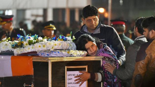 Captain Kapil Kundu's sister mourns while paying tribute to her brother after his mortal remains were brought at Air Force Station Palam in New Delhi on Monday. (PTI) Captain Kapil Kundu's sister mourns while paying tribute to her brother after his mortal remains were brought at Air Force Station Palam in New Delhi on Monday. (PTI)