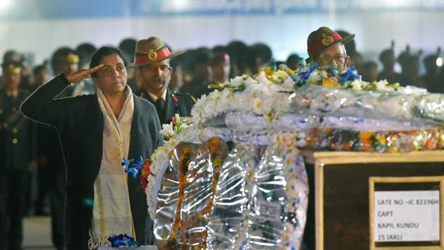 Defence minister Nirmala Sitharaman pays tribute to Captain Kapil Kundu after his mortal remains were brought at AFS Palam in New Delhi on Monday. Captain Kundu was killed along the LoC in Jammu and Kashmir's Rajouri district along with three other soldiers in shelling from Pakistan side.(PTI Photo)