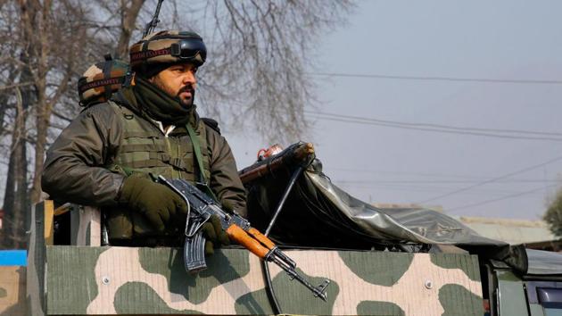 An Army person stands guard outside the CRPF training camp at Lethpora in Pulwama district of south Kashmir.(PTI File Photo)