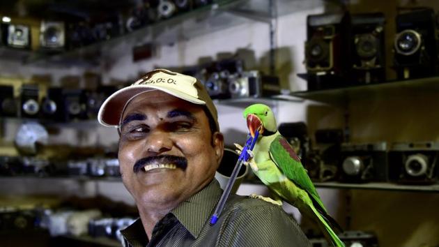 Joseph Sekar, known popularly as ‘Birdman’ in Chennai’s Royapettah area, seen with a parakeet at his home in Chennai. Sekar spends 40% of his income on feeding parakeets, who first visited him after the 2006 Southeast Asia floods. Nothing brings the camera technician by day, more happiness than watching the birds fly and knowing they are well-fed and healthy. (R Senthil Kumar / PTI)