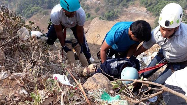 The team members of Shivdurga rescue Sachin Upadhyay who fell into a gorge at Lion’s point in Lonavla in Pune on Monday.(HT PHOTO)