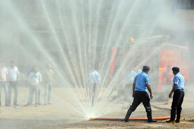 Firefighters during a fire safety drill to showcase the various safety precautions and methods to Round Table India members on Sunday, February 4. (Shankar Narayan/HT PHOTO) Firefighters during a fire safety drill to showcase the various safety precautions and methods to Round Table India members on Sunday, February 4. (Shankar Narayan/HT PHOTO)
