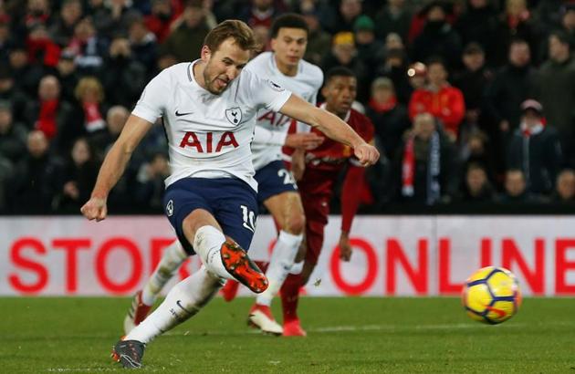 Tottenham Hotspur's Harry Kane scores their second goal from a penalty against Liverpool in their Premier League clash at Anfield on Sunday.(REUTERS)