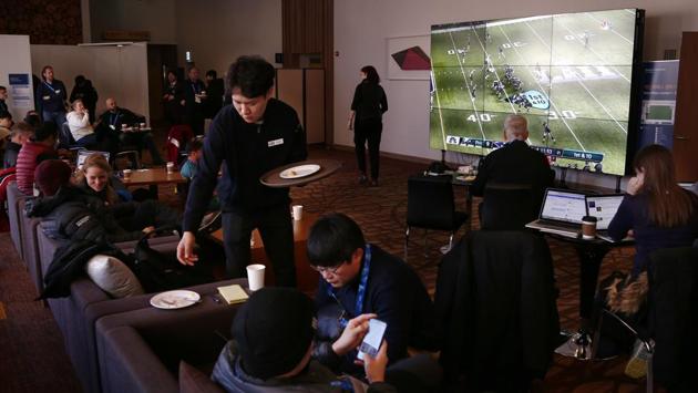 The actual events are still a few days off but sports fever is already on as people gather to watch a broadcast of the Super Bowl in the Main Press Center in Pyeongchang. (Peter Morgan / AP) The actual events are still a few days off but sports fever is already on as people gather to watch a broadcast of the Super Bowl in the Main Press Center in Pyeongchang. (Peter Morgan / AP)