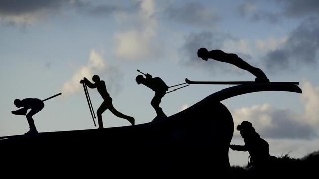 A woman looks at a sculpture of skiers outside the Alpensia Ski Jumping Center. The games will feature 102 events in 15 sports making it the first edition to cross 100 medal events. (Charlie Riedel / AP) A woman looks at a sculpture of skiers outside the Alpensia Ski Jumping Center. The games will feature 102 events in 15 sports making it the first edition to cross 100 medal events. (Charlie Riedel / AP)