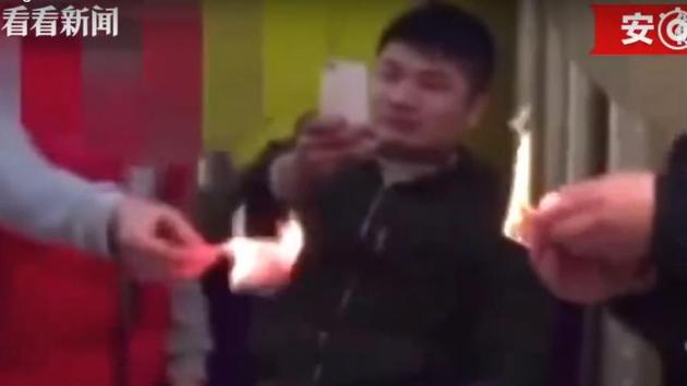 The two were tracked by the police and fined for “deliberately damaging or defacing Chinese currency”, a criminal offence in China, after the video went viral on social media networks.(YouTube/Screengrab)