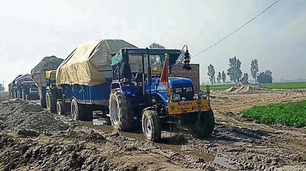 Tractor-trailers seized for illegal sand mining at Jalloke village in Tarn Taran on Monday;(HT Photo)