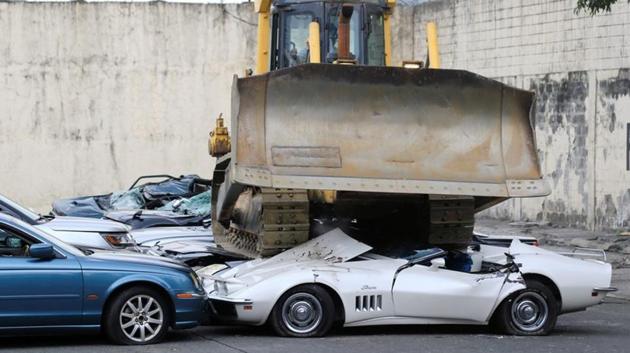 A bulldozer destroys condemned smuggled luxury cars worth 61,626,000.00 pesos (approximately US$1.2 million), which include used Lexus, BMW, Mercedes-Benz, Audi, Jaguar and Corvette Stingray, during the 116th Bureau of Customs founding anniversary in Metro Manila, the Philippines, on February 6, 2018. (Reuters) A bulldozer destroys condemned smuggled luxury cars worth 61,626,000.00 pesos (approximately US$1.2 million), which include used Lexus, BMW, Mercedes-Benz, Audi, Jaguar and Corvette Stingray, during the 116th Bureau of Customs founding anniversary in Metro Manila, the Philippines, on February 6, 2018. (Reuters)