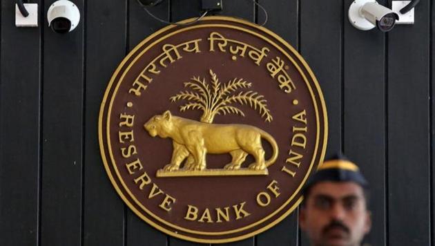 A security personnel member stands guard at the entrance of the Reserve Bank of India (RBI) headquarters in Mumbai, India. (Reuters) A security personnel member stands guard at the entrance of the Reserve Bank of India (RBI) headquarters in Mumbai, India. (Reuters)