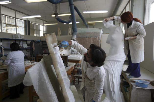 Each piece is made to scale, out of plaster in molds and painstakingly hand-painted to match the hues of the original, be it metal, marble, clay or ivory. Plaster is used because it doesn’t shrink while drying, unlike other materials such as resin, and allows reproductions that are completely accurate in size. (Thanassis Stavrakis / AP) Each piece is made to scale, out of plaster in molds and painstakingly hand-painted to match the hues of the original, be it metal, marble, clay or ivory. Plaster is used because it doesn’t shrink while drying, unlike other materials such as resin, and allows reproductions that are completely accurate in size. (Thanassis Stavrakis / AP)