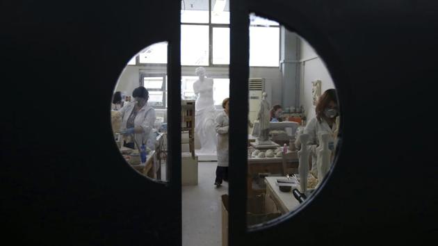 Employees of the Culture Ministry work in the lab. The nearly 50 artists at this workshop hold the exclusive right to craft the country’s only officially certified copies of ancient art pieces which are meant for sale in Greek museum shops and archaeological sites. (Thanassis Stavrakis / AP) Employees of the Culture Ministry work in the lab. The nearly 50 artists at this workshop hold the exclusive right to craft the country’s only officially certified copies of ancient art pieces which are meant for sale in Greek museum shops and archaeological sites. (Thanassis Stavrakis / AP)